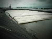 Wastewater treatment system construction and dredge solids dewatering